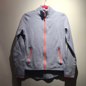 Women’s athletic jacket with thumb holes.